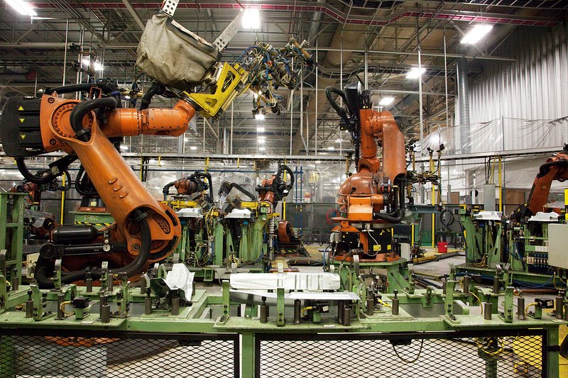 An automotive manufacturing plant with robotic weld cells running on the line.