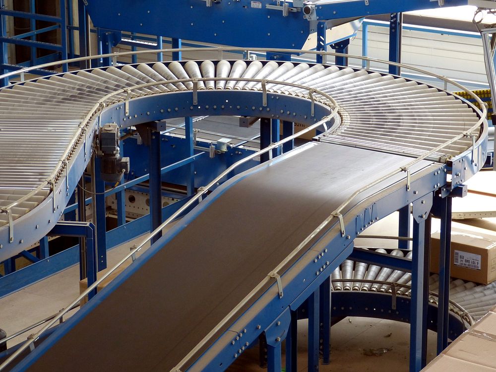 Curved conveyor lines running through a material-handling facility.